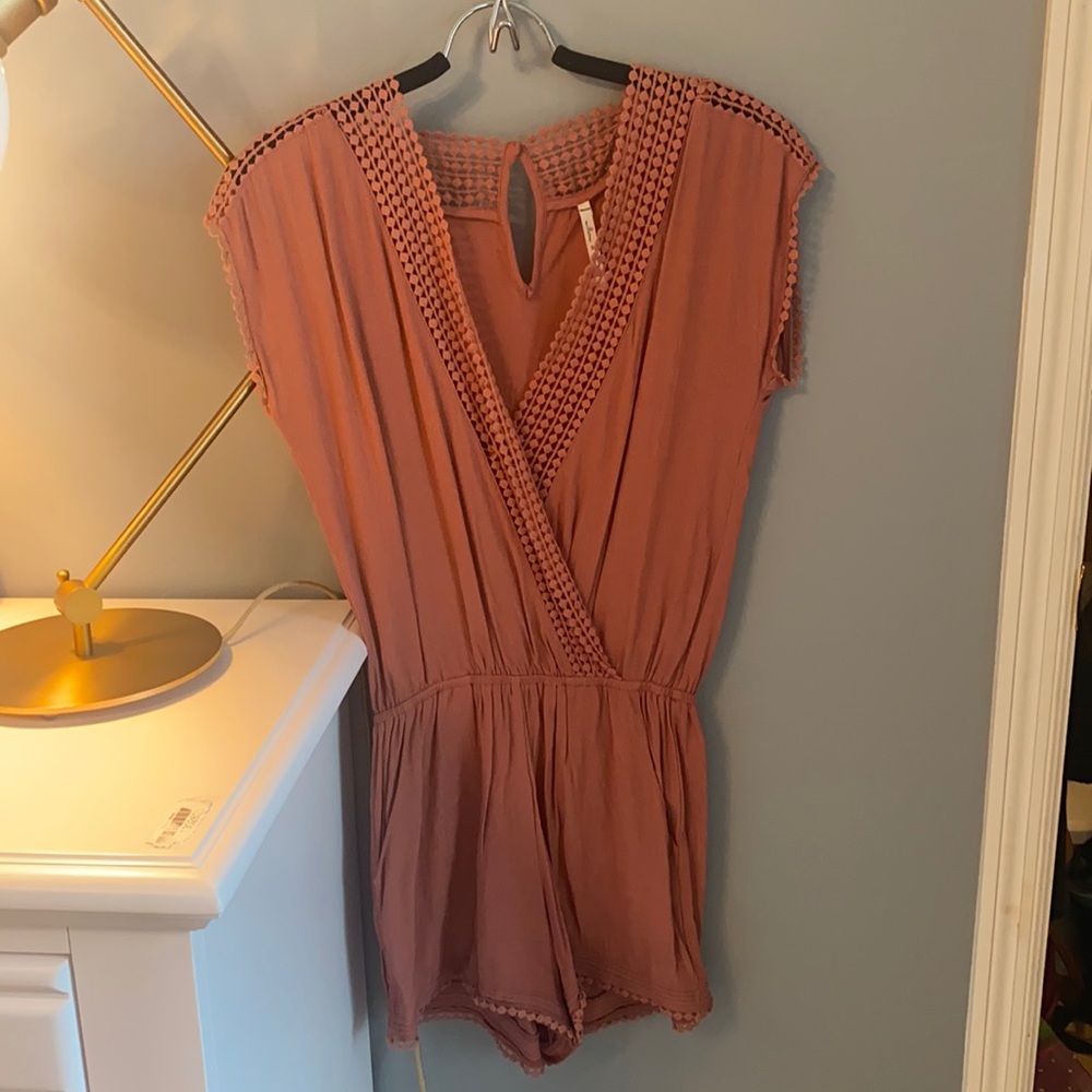 Short sleeves, romper with cute detail. Worn once